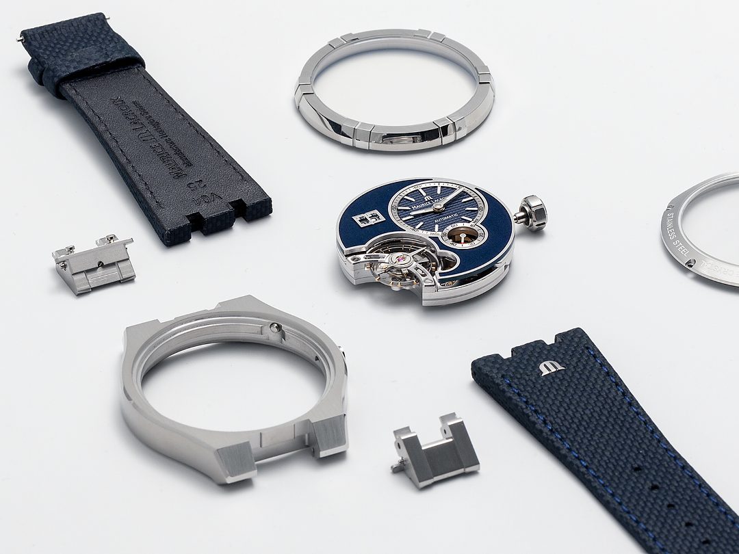 A Maurice Lacroix watch fully dismantled: case, bezel, crystal, straps, and movement